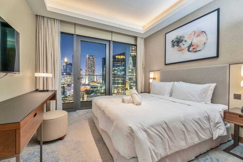 Bedroom: Enjoy stunning skyline views from your elegant retreat at night!