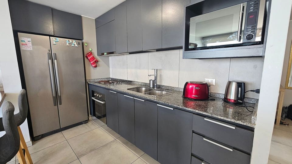 Apartment | Private kitchen | Fridge, microwave, oven, electric kettle