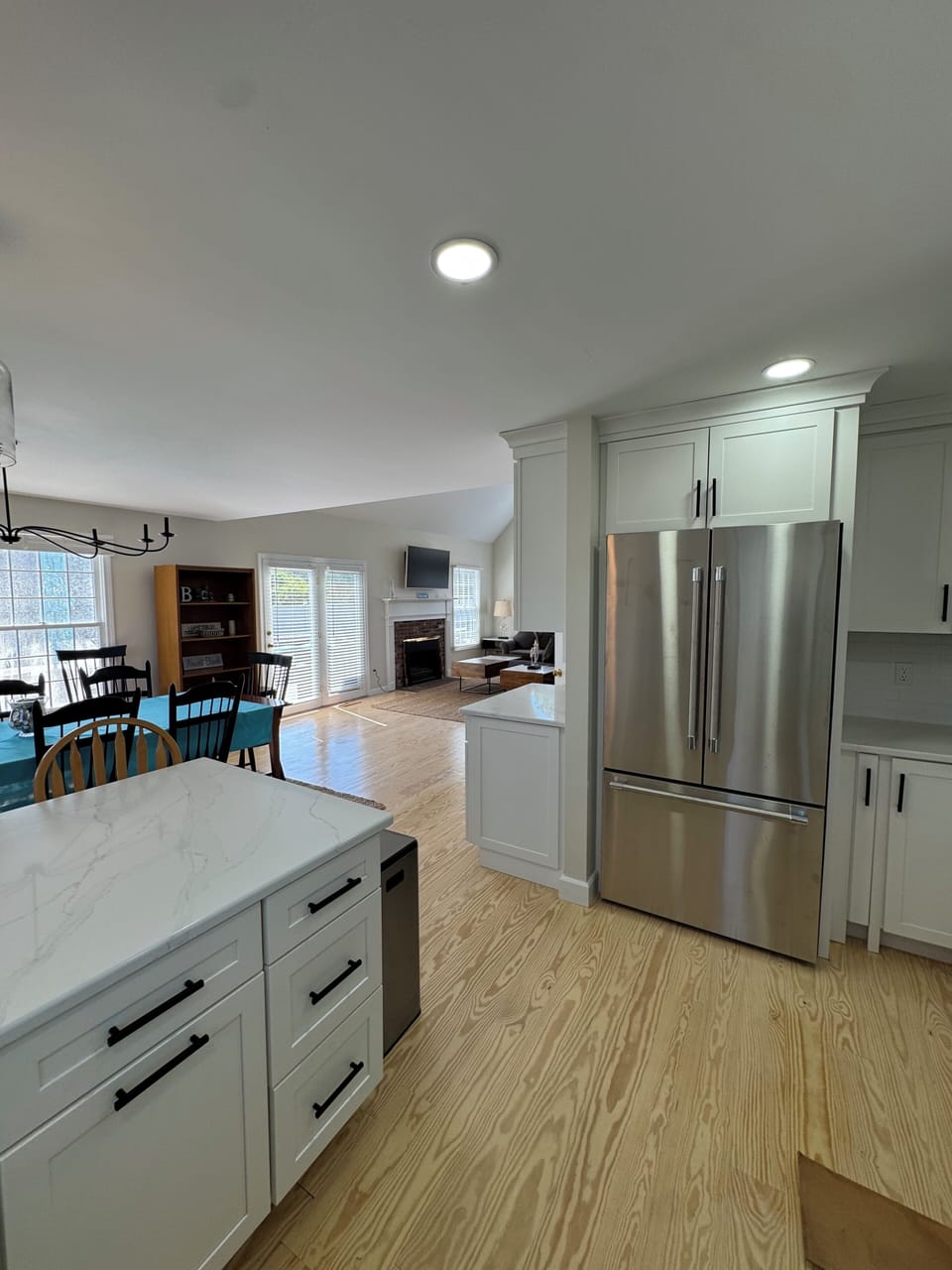 View showing open floor plan - kitchen leads to high ceilinged great room.