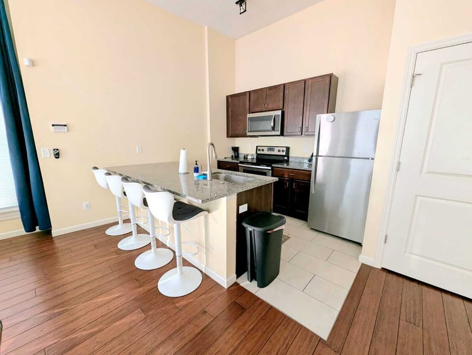 The kitchen features spacious countertops, offering ample room for meal prep.
