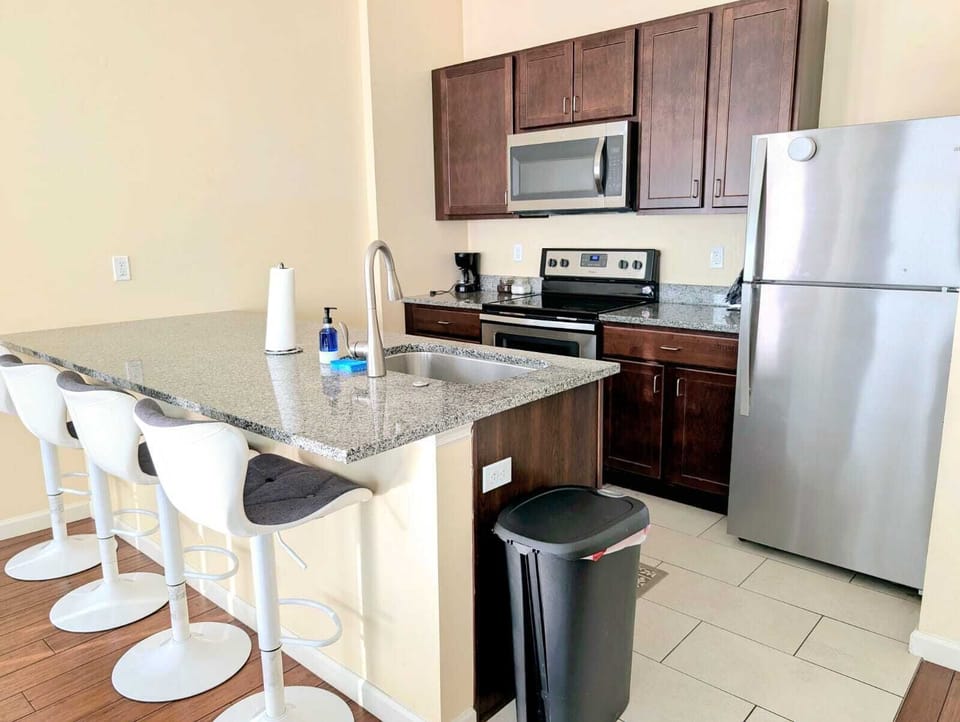 The kitchen features spacious countertops, offering ample room for meal prep.
