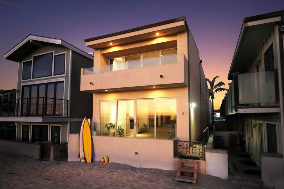 A serene oceanfront retreat with stunning island views at the beach on the sand.