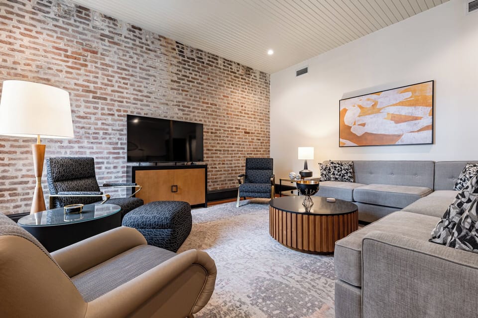 Spacious living area featuring preserved historical elements, complemented by an elegant and contemporary design.