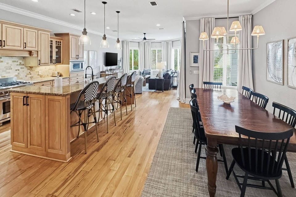 Find yourself inside a large open space including the kitchen, dining area, and living room.
