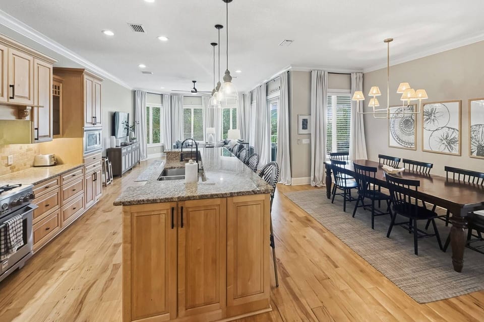 Find yourself inside a large open space including the kitchen, dining area, and living room.