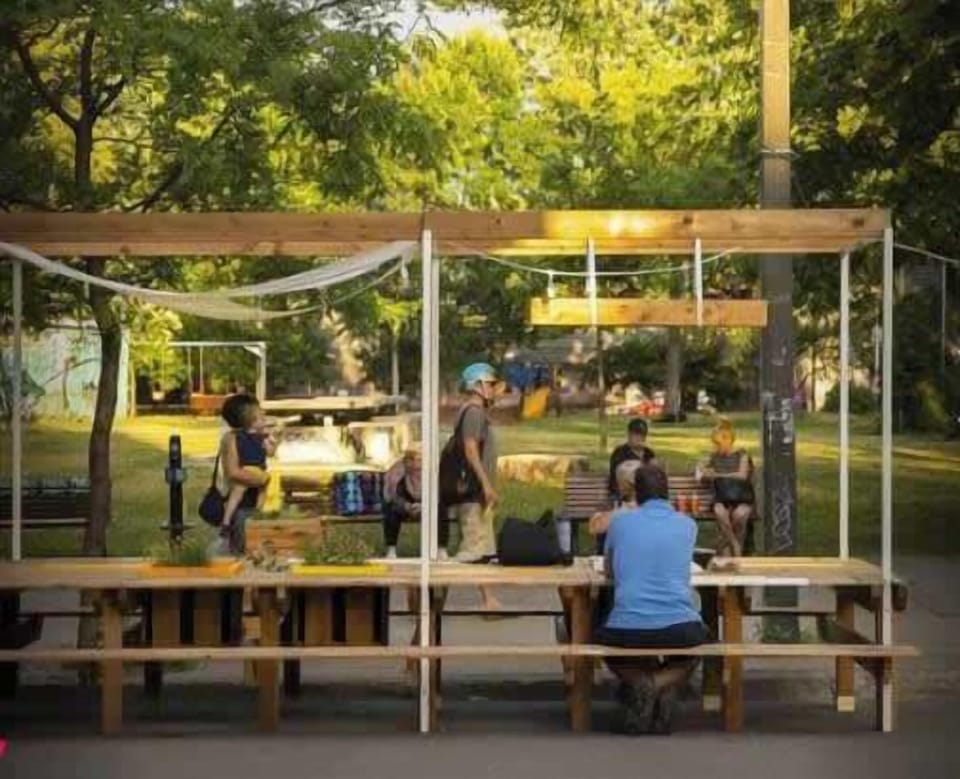 Mont-Royal Avenue in the summer filled with eateries, rest stops, activities, art, shows and more