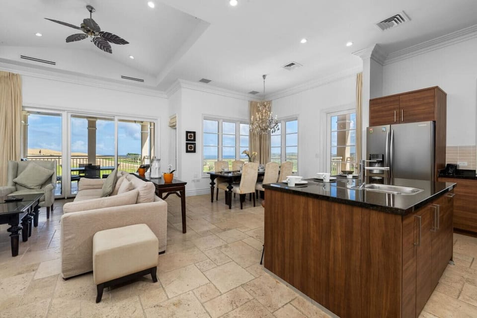 An inviting and spacious living area, designed for both relaxation and entertainment, with stunning views that extend to the outdoors.