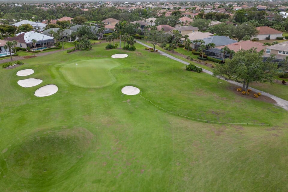 Watch golfers on the green behind the home; please note, this is a private course and golf is not available to non-residents.