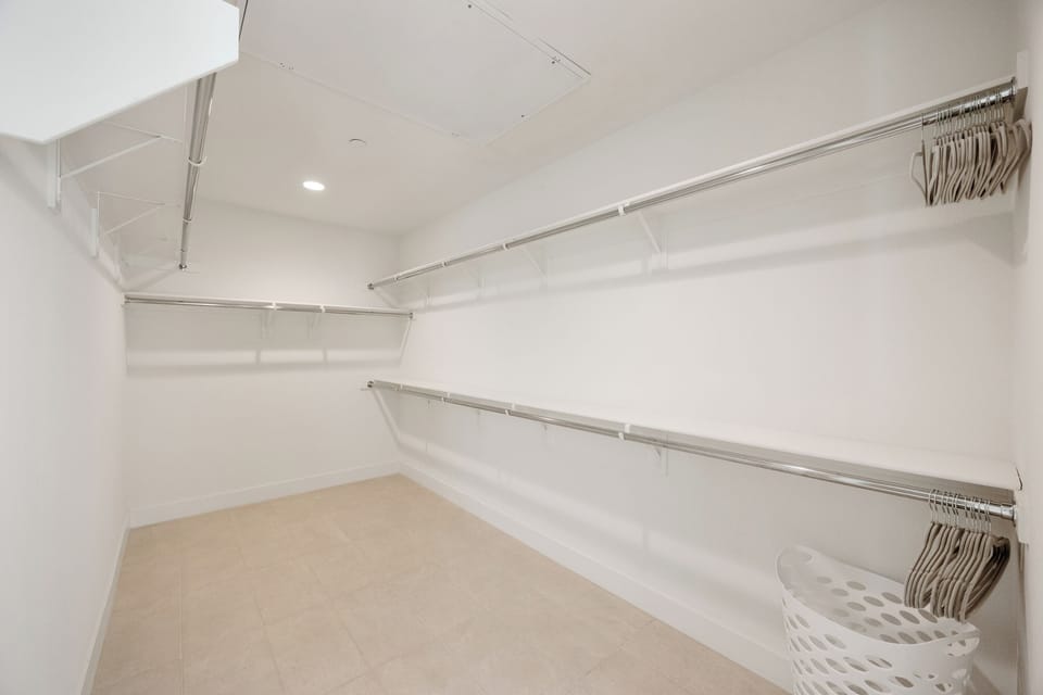 A huge walk-in closet with built-in storage for all your vacation wardrobe needs.