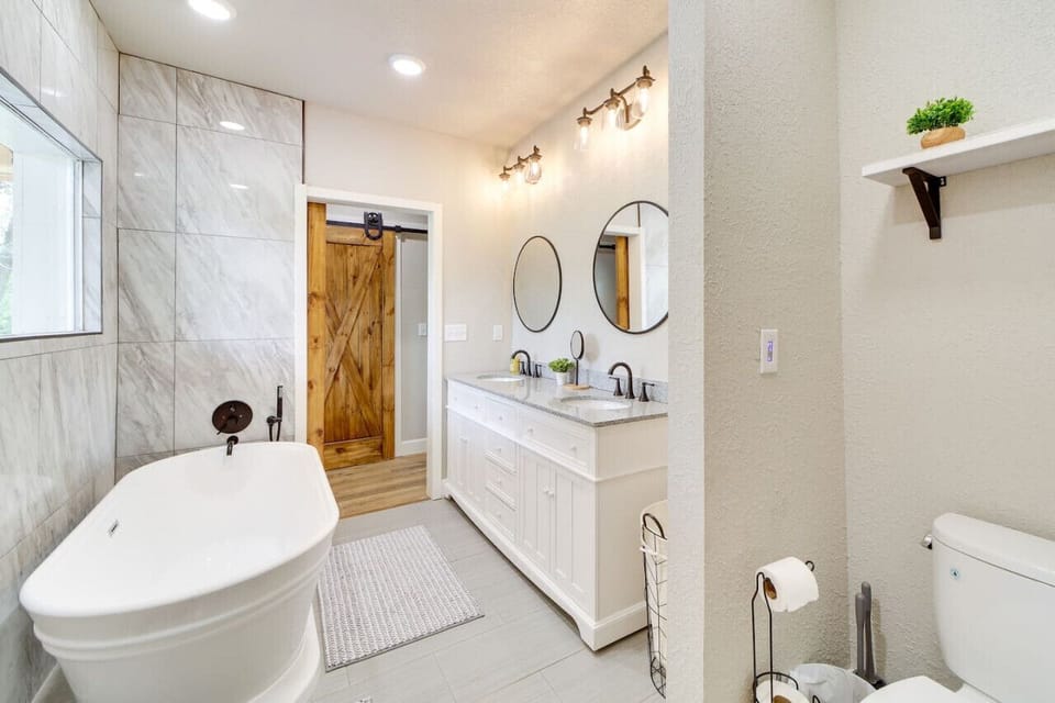 Primary ensuite bath with shower and large soaking tub