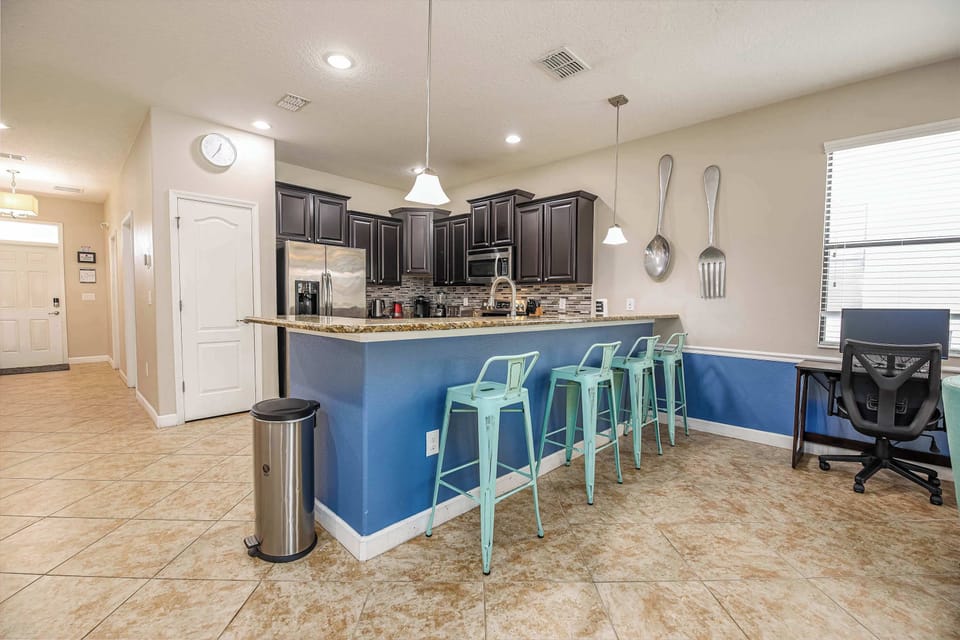 Gather around the stylish kitchen island with bar seating, perfect for quick bites or conversations.