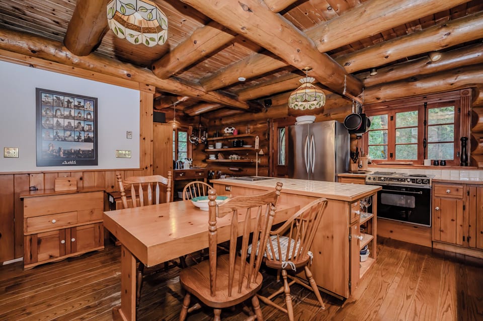 With its open layout and warm wood tones, the kitchen becomes the heart of the home—ideal for entertaining or enjoying the art of cooking in a tranquil environment.