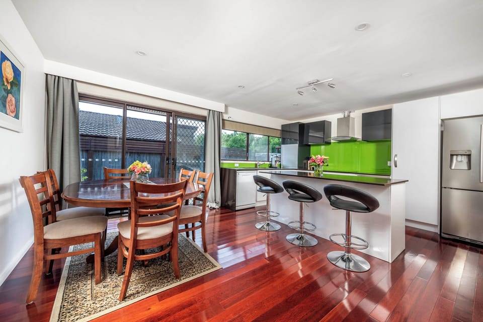 Dining area opens out to the large deck with additional outdoor seating/dining