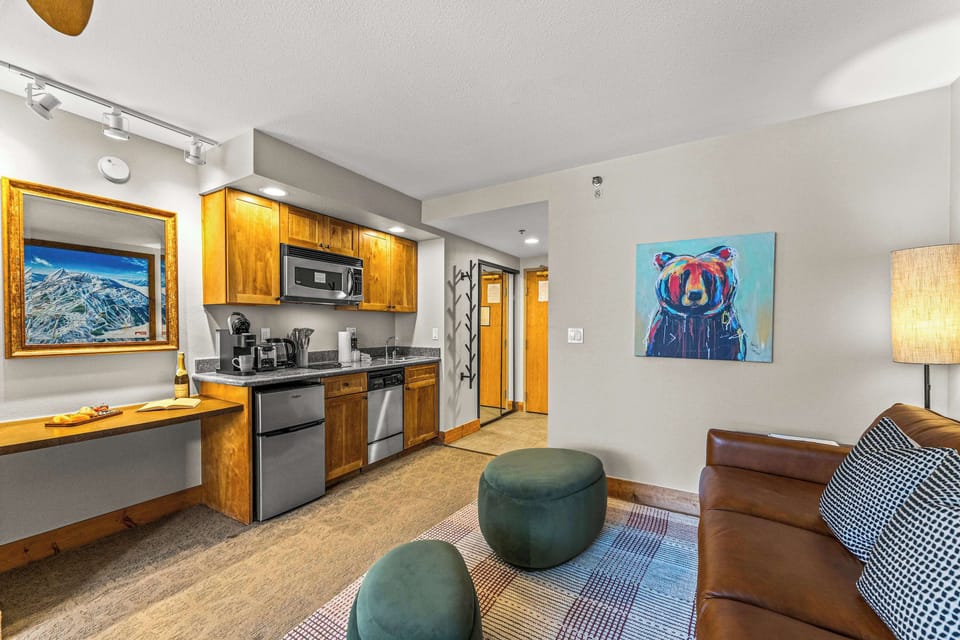 【Studio Layout】Full room at a glance — king bed, pullout, kitchenette, and dining in one open plan