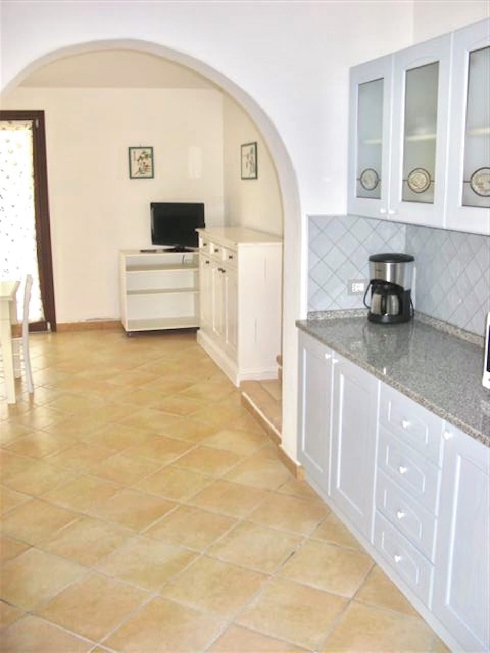 Villa | Living area | 24-inch flat-screen TV with satellite channels