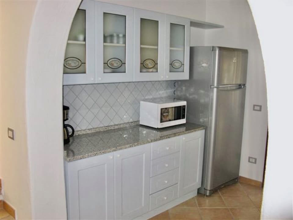 Villa | Living area | 24-inch flat-screen TV with satellite channels