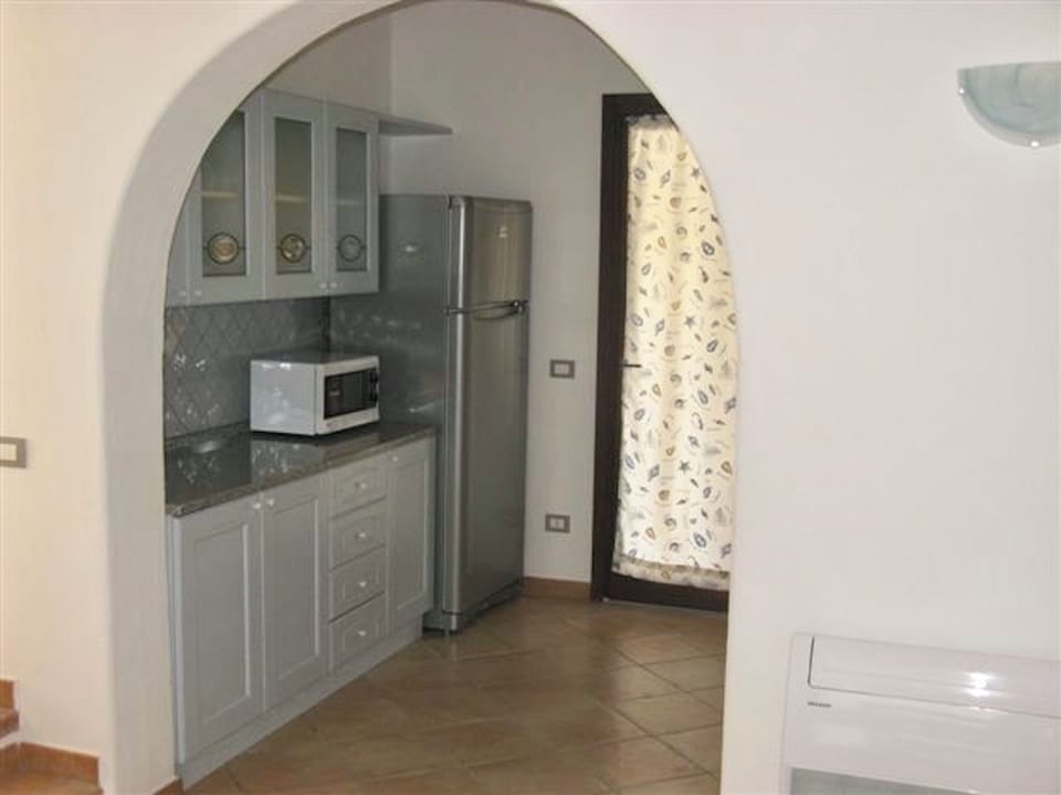 Villa | Living area | 24-inch flat-screen TV with satellite channels