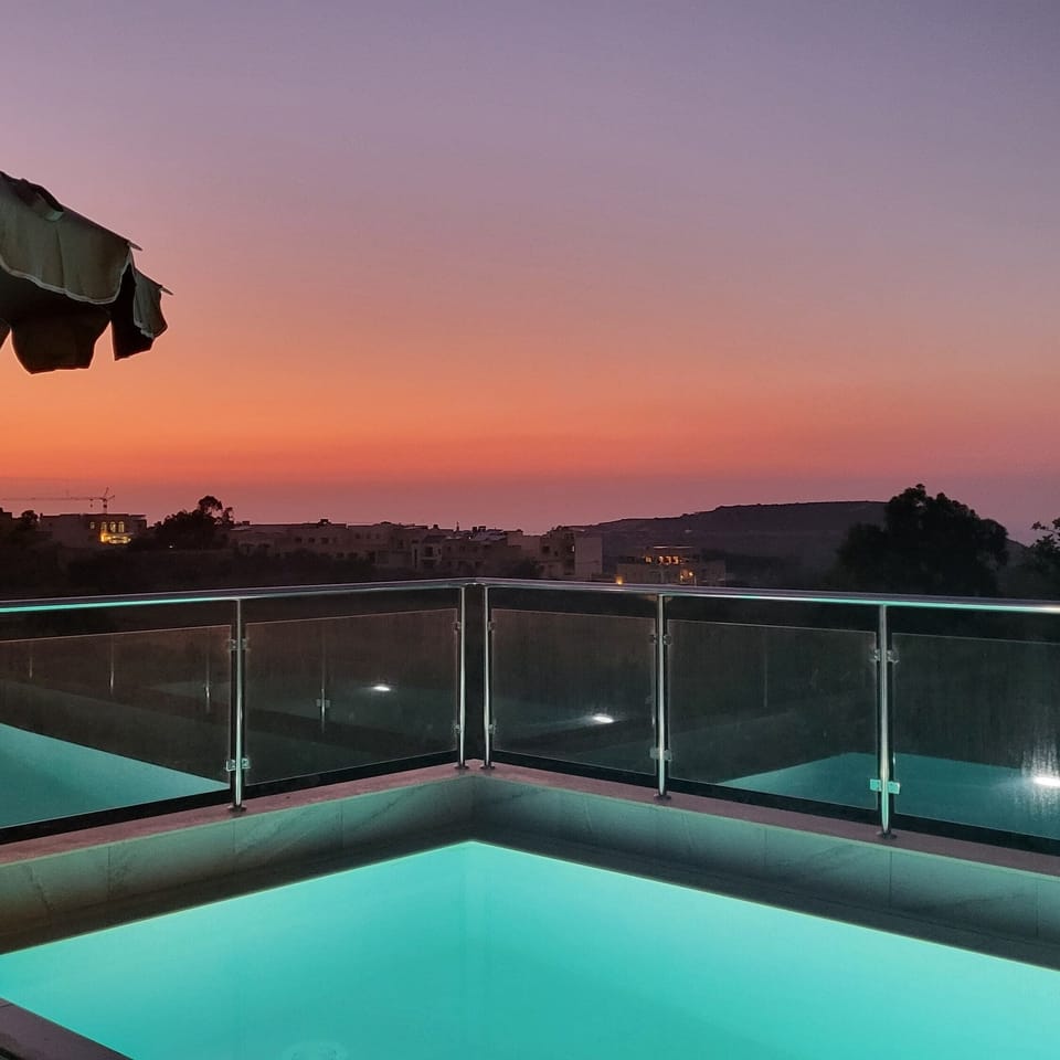 Seasonal outdoor pool, open 9:30 AM to 9:00 PM, pool umbrellas