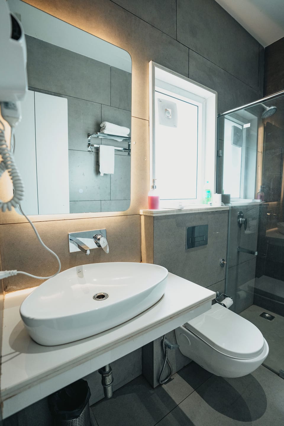 Shower, hair dryer, slippers, towels