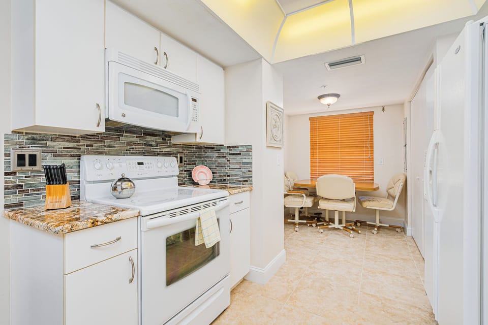 Kitchen leads into breakfast nook