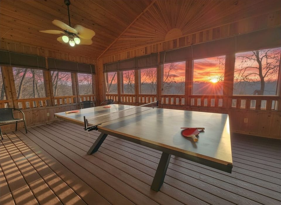 Challenge someone to ping pong while the sun drops over the valley — the game room has floor-to-ceiling windows so the view never leaves the room.