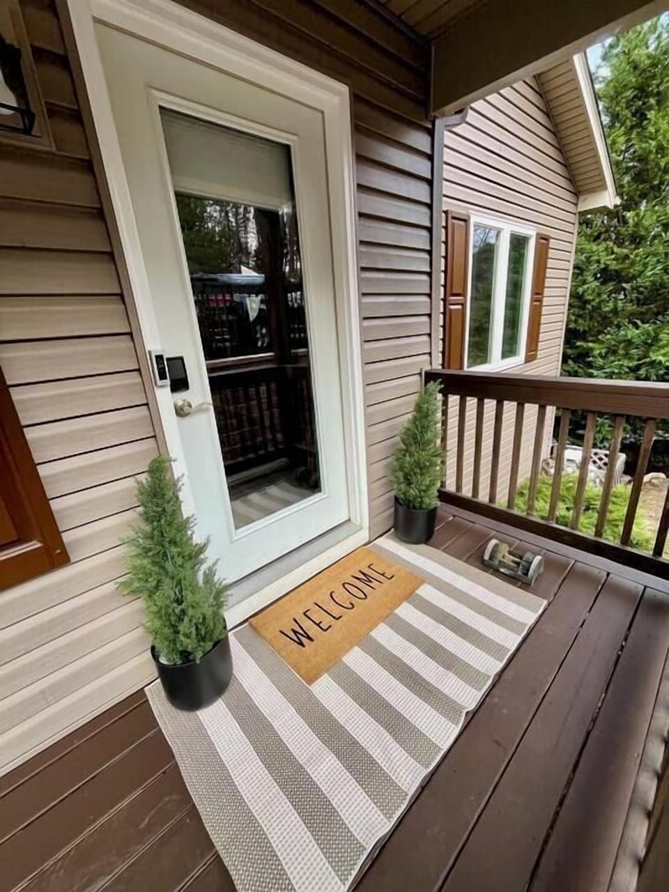 Walk right through this door the second you pull in, bags and all. Two little evergreens by the entry are your first hint of what's waiting inside.