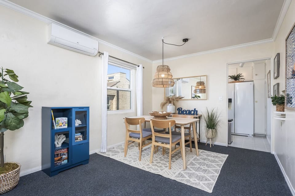 Dining area with seating for four people.  Apartment includes mini-split unit for AC, heating, and air flow.