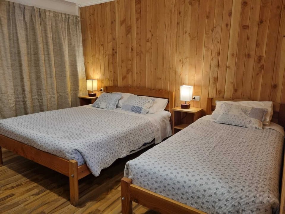 Triple Room, Garden View | Minibar, laptop workspace, blackout drapes, free WiFi