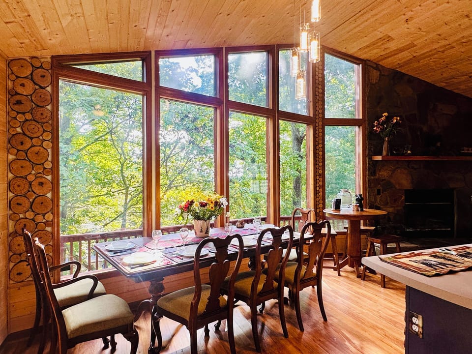 Bright & Inviting Dining Room: Dine in style with stunning mountain views.