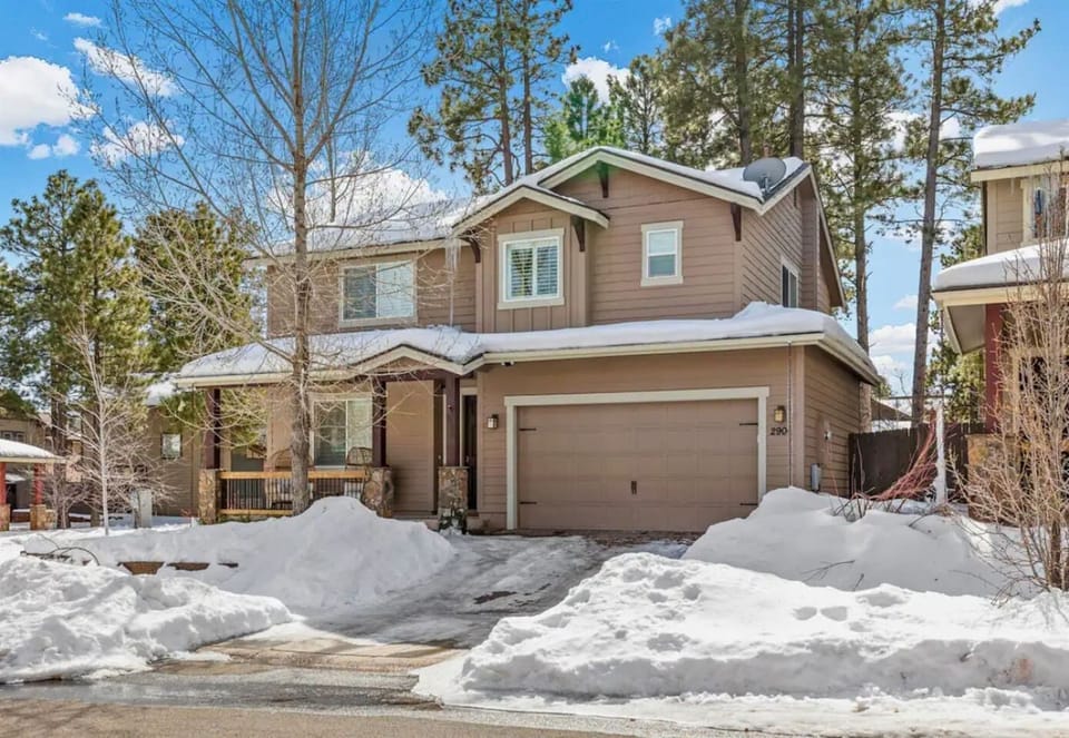 The exterior of the home showcases a beautiful blend of modern design and natural surroundings, offering a welcoming and stylish entrance to your retreat.