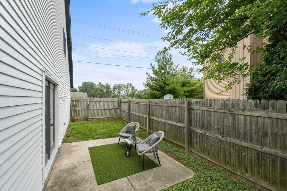 Inviting backyard featuring cozy furniture, perfect for relaxing and enjoying the outdoors in comfort.