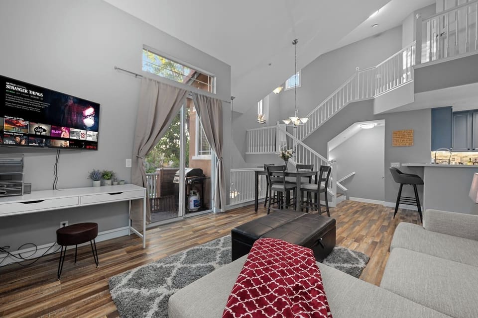 Inviting living room with a clear view of the stairs leading to the second floor, creating an open and spacious atmosphere that connects the levels of the home.