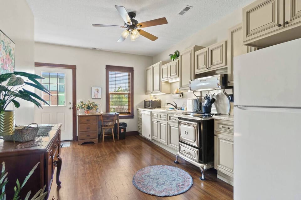 Fully equipped kitchen with modern appliances, ample counter space, and everything you need for cooking and dining.