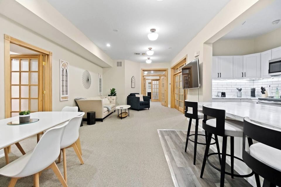Spacious view of the living area, kitchen, and dining, seamlessly blending style and comfort for an open and inviting atmosphere.