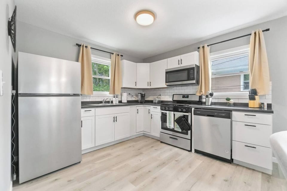 Fully equipped kitchen with all the essentials for cooking, including modern appliances and cookware.