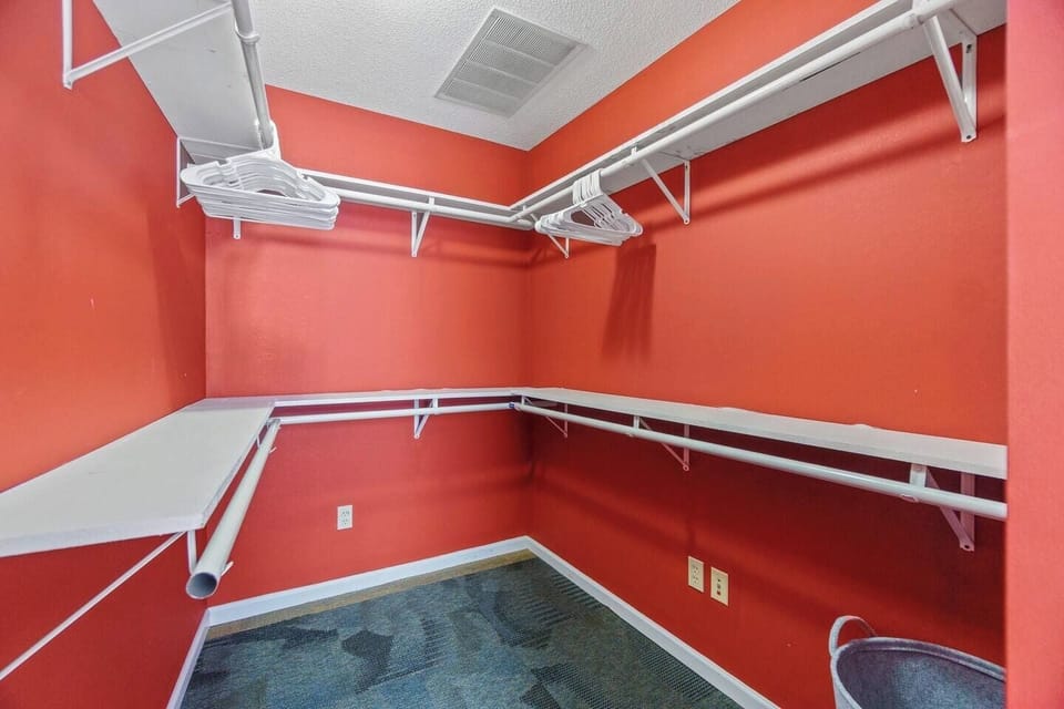 Ample clothing storage with a dresser, closet, or wardrobe, providing plenty of space to keep your items organized during your stay.