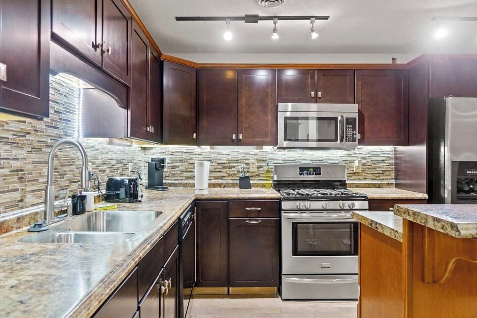 Fully equipped kitchen with modern appliances, ample counter space, and all the essentials for a convenient and enjoyable stay.