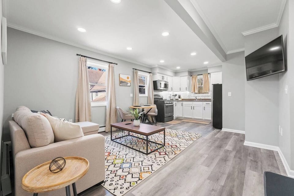 Open view of the living and kitchen area, seamlessly blending comfort and functionality for a spacious, airy feel.