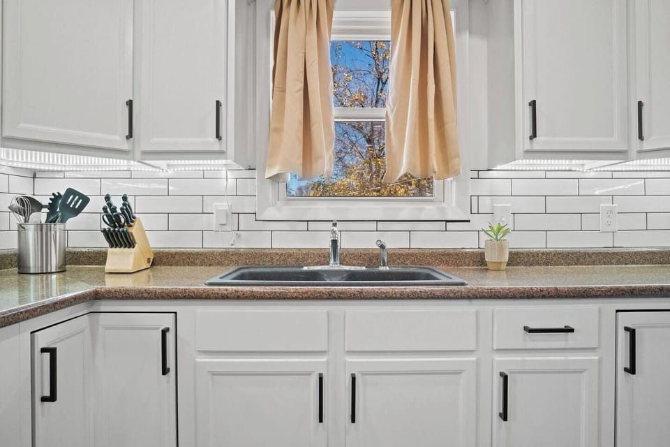 Clean and spacious kitchen faucet.