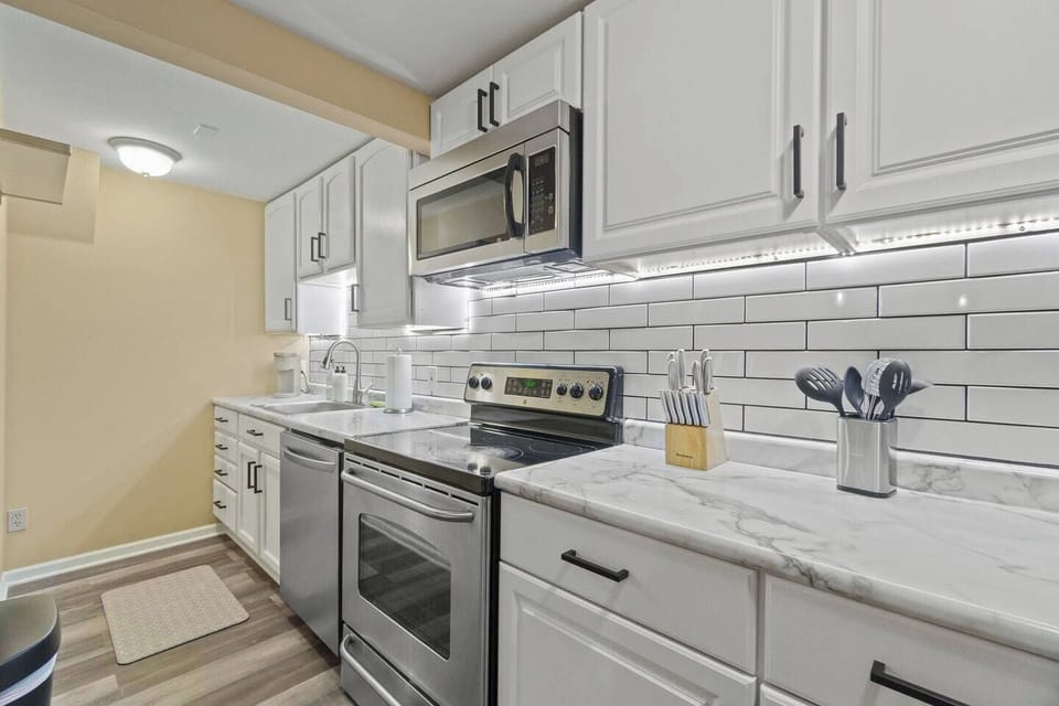Fully equipped kitchen with modern appliances, ample counter space, and all the essentials for a convenient and enjoyable stay.
