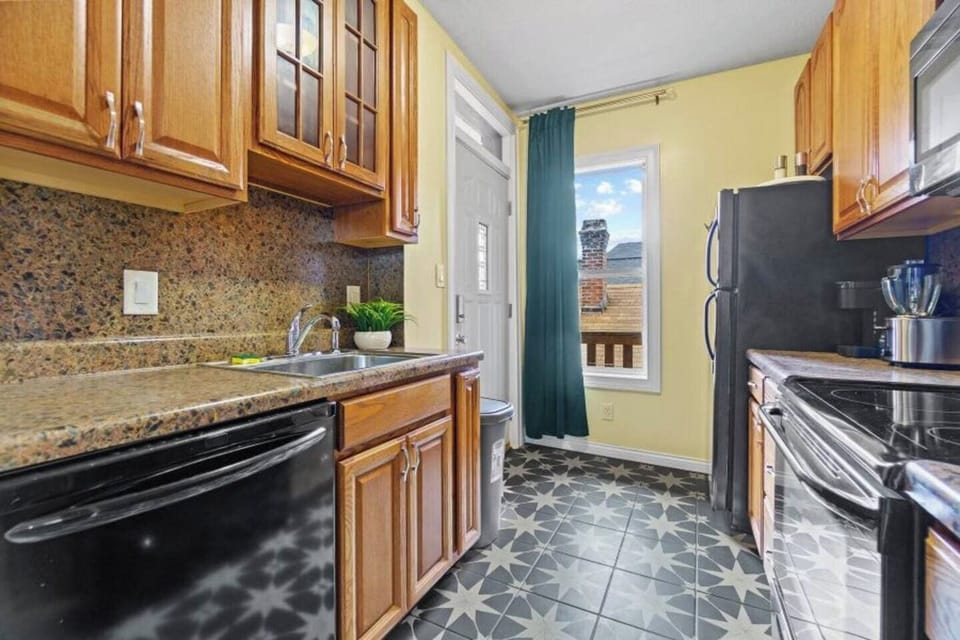 Spacious kitchen with ample cabinets, offering plenty of storage and counter space for cooking and meal prep.