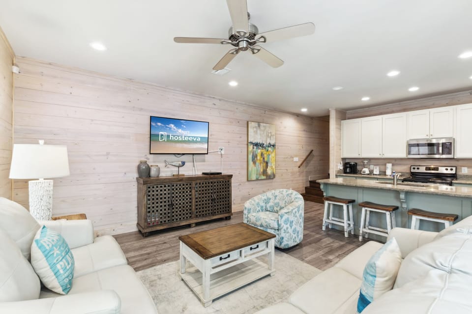 Signature House, 2 Bedrooms, Balcony, Garden View | Living room | 65-inch Smart TV with cable channels
