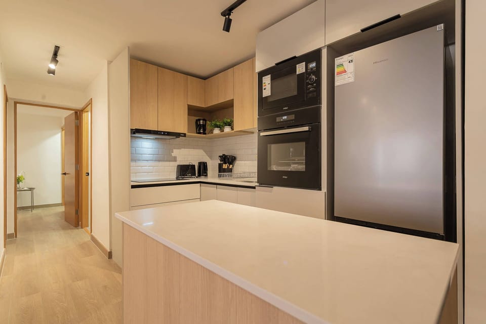 Sleek and modern kitchen with top-notch appliances and ample space for culinary adventures.