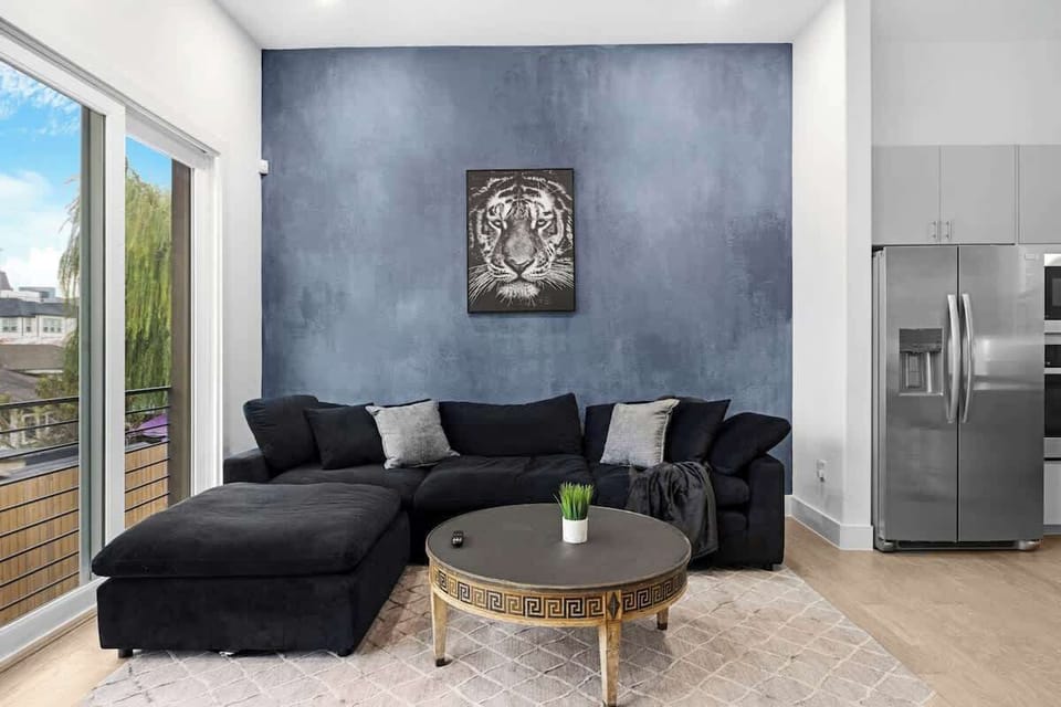 Stream your favorite shows in this bright, cozy living area w/ comfy seating & a clean, modern feel.
