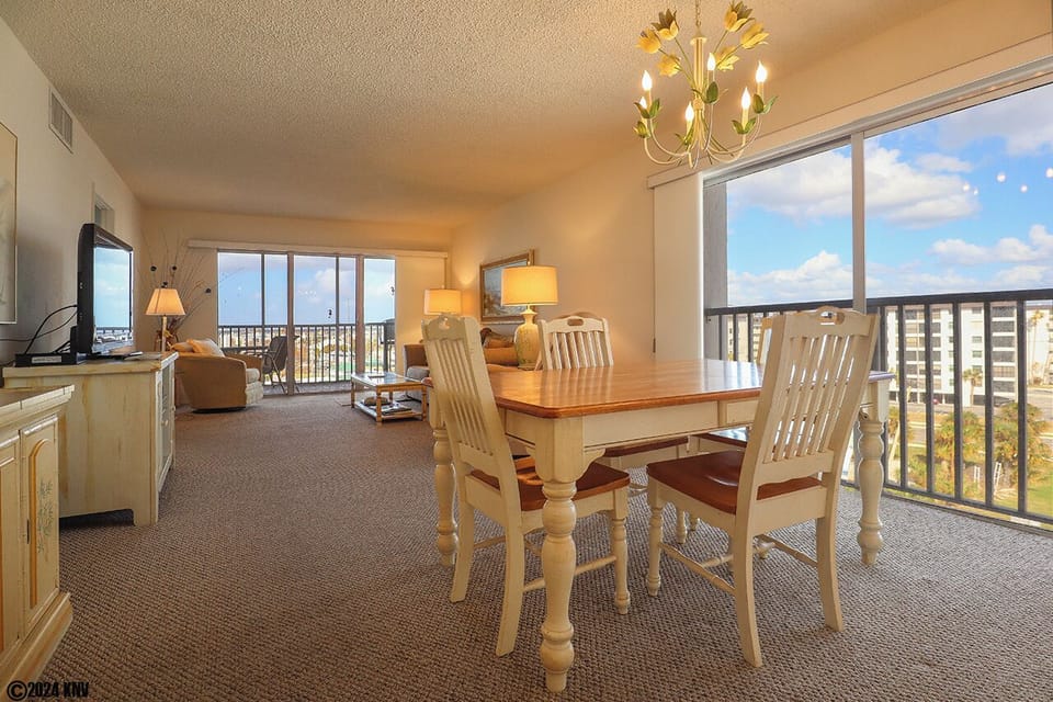 This corner condo features lots of glass sliders so you can enjoy views of the Gulf and island