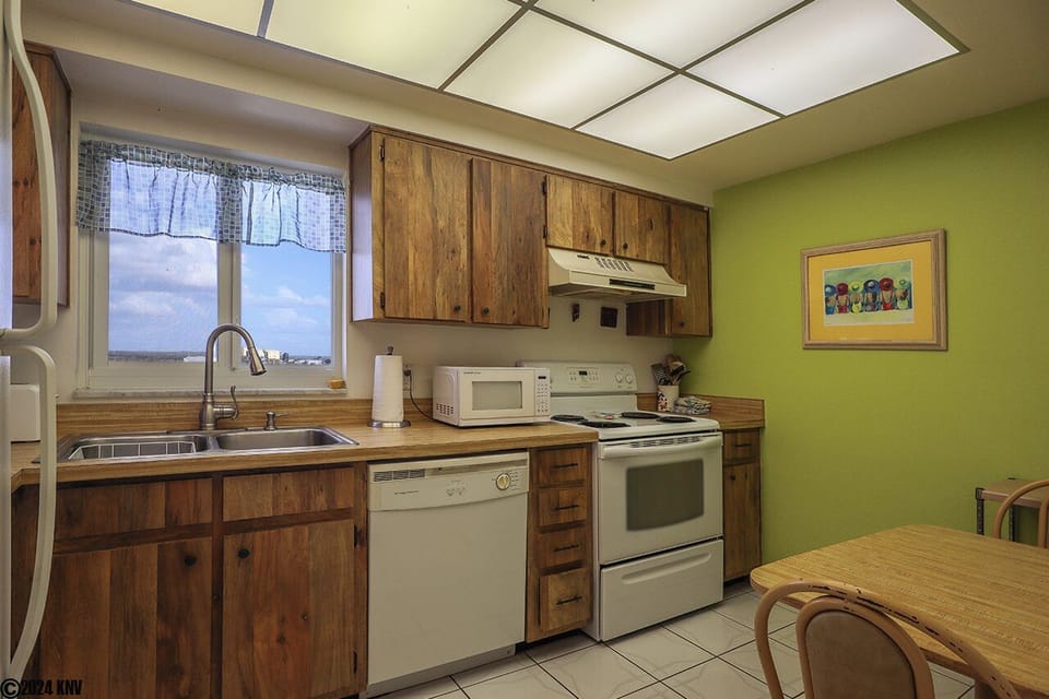 Kitchen is fully equipped with all appliances and cookware.