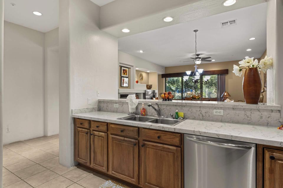 A functional cooking space with a seating counter, perfect for enjoying meals and staying connected to the living room