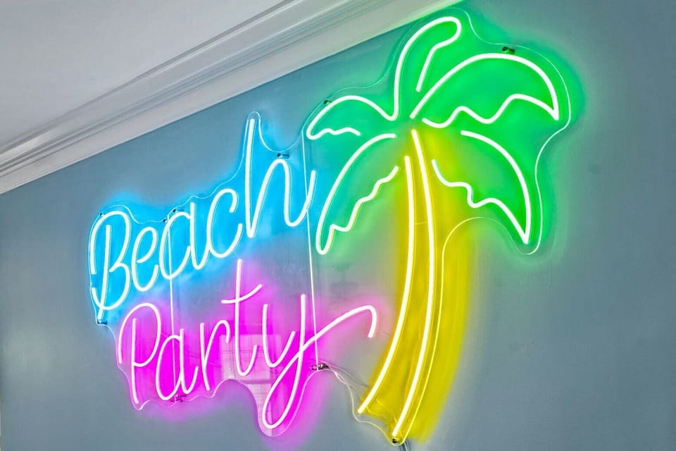 closeup of the neon beach party sign at the bar