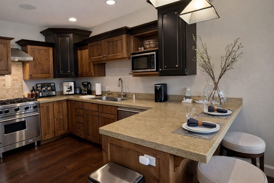 Your fully equipped kitchen awaits with granite counters, stainless appliances, and breakfast bar—perfect for morning coffee or cooking together.