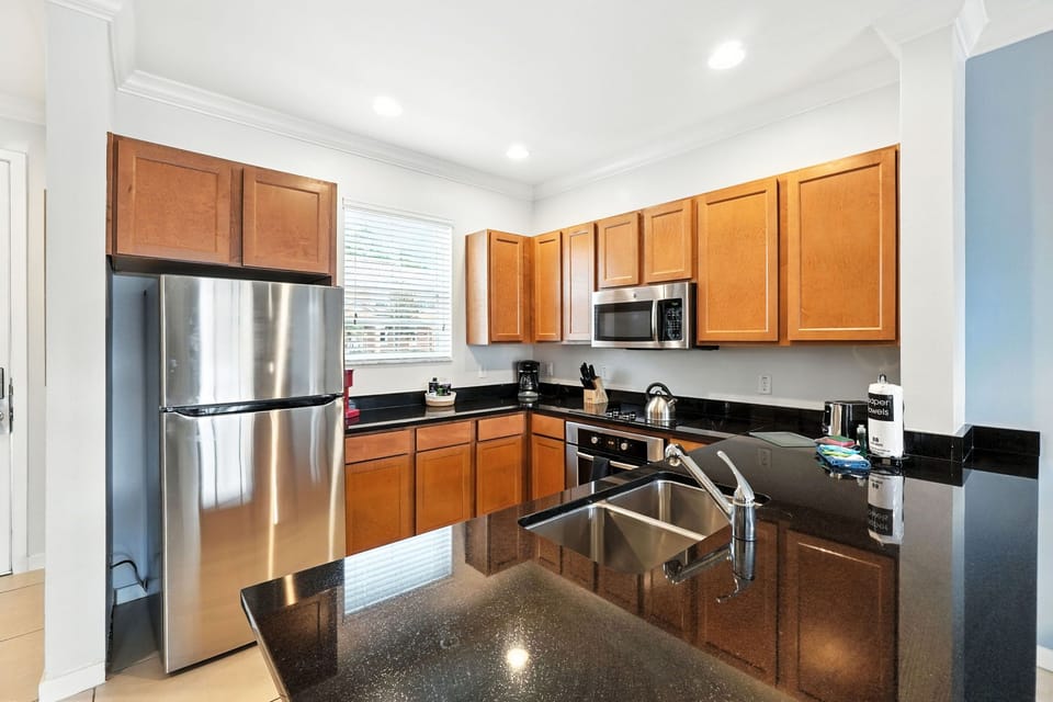 Spacious kitchen with granite countertops and stainless steel appliances